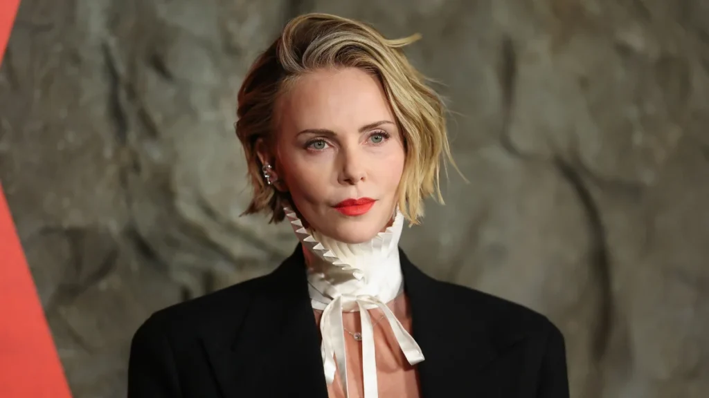 Charlize Theron Redefines Red Carpet Masculinity in Dior Men’s Tailoring at the New York Premiere of Netflix Thriller Apex