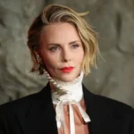 Charlize Theron Redefines Red Carpet Masculinity in Dior Men’s Tailoring at the New York Premiere of Netflix Thriller Apex