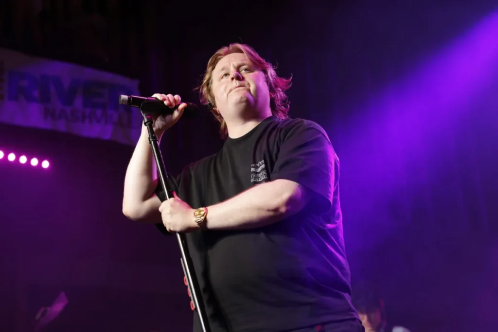 Lewis Capaldi Confirms Identity Behind Mystery Pitched-Down Vinyl Stunt While Thrilling New York Fans with Surprise Penn Station Performance