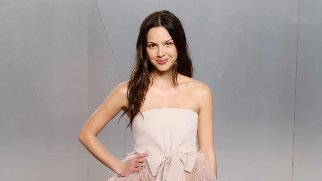 Olivia Rodrigo Redefines Modern Coquette Aesthetic with Custom Jane Doe Babydoll Dress and Miu Miu Accessories during Los Angeles Celebration