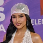 Becky G Redefines Modern Tailoring by Integrating the Peekaboo Bra Trend into a Sophisticated Suit Ensemble for Maybelline Campaign