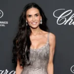 Demi Moore Captivates at Chopard Gala in Plunging Tamara Ralph Crystal Gown and Ostrich Feather Stole
