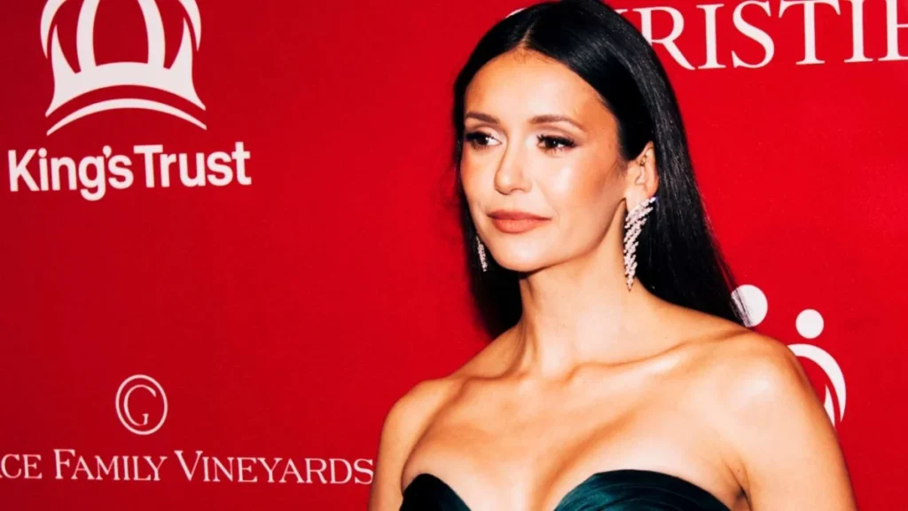 Nina Dobrev Puts on a Leggy Display in a Risqué Plunging Dress