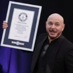 Pitbull sets unique Guinness World Record as thousands wear bald caps in London