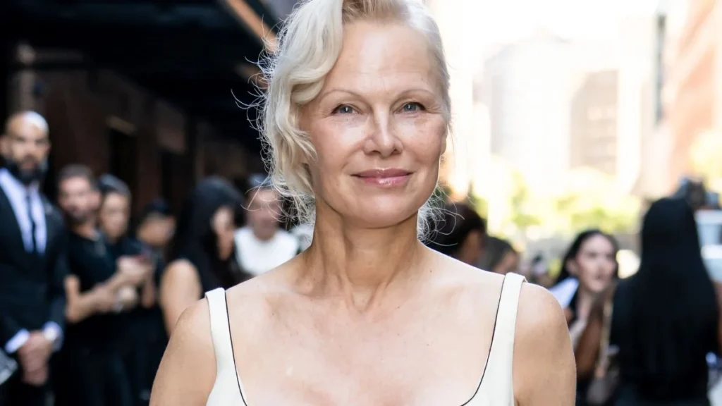 Pamela Anderson Keeps It Simple and Classy at NYFW Show in Low-Cut Calvin Klein Dress