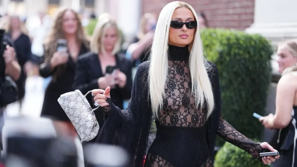 Paris Hilton elevates completely see-through lace dress with chic Gucci bag for NYFW show