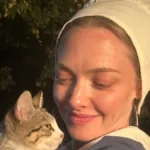 Amanda Seyfried’s Victoria’s Secret bralette is on full display under open Khaite leather jacket for WWD