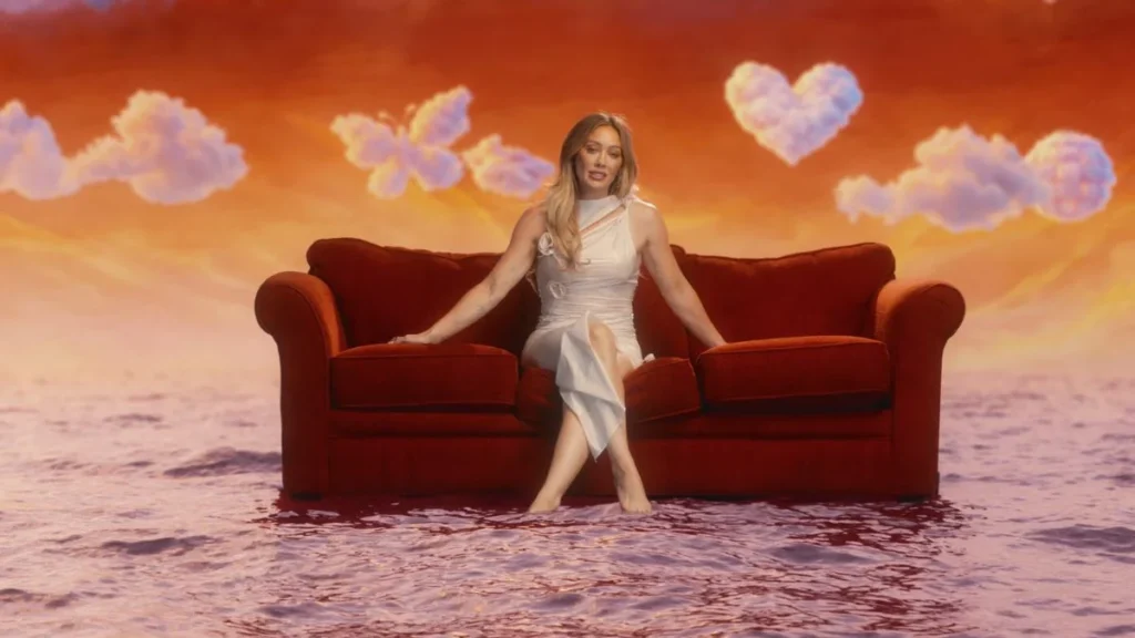 Hilary Duff flaunts her curves in body-hugging Coperni wet cutout dress for CATastrophe MV