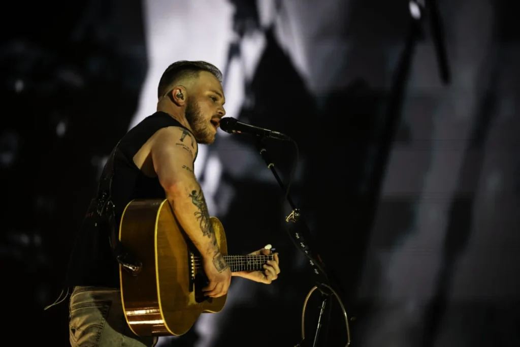 Zach Bryan Wears Free Palestine Shirt at Robert Krafts Gillette Stadium Following Macklemore Tour Controversy